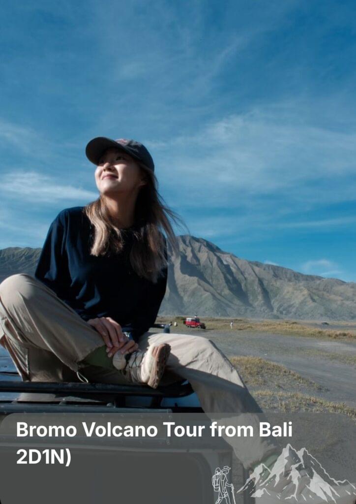 Travellers exploring the volcanic landscape of Mount Bromo during a volcano tour from Bali, East Java.”